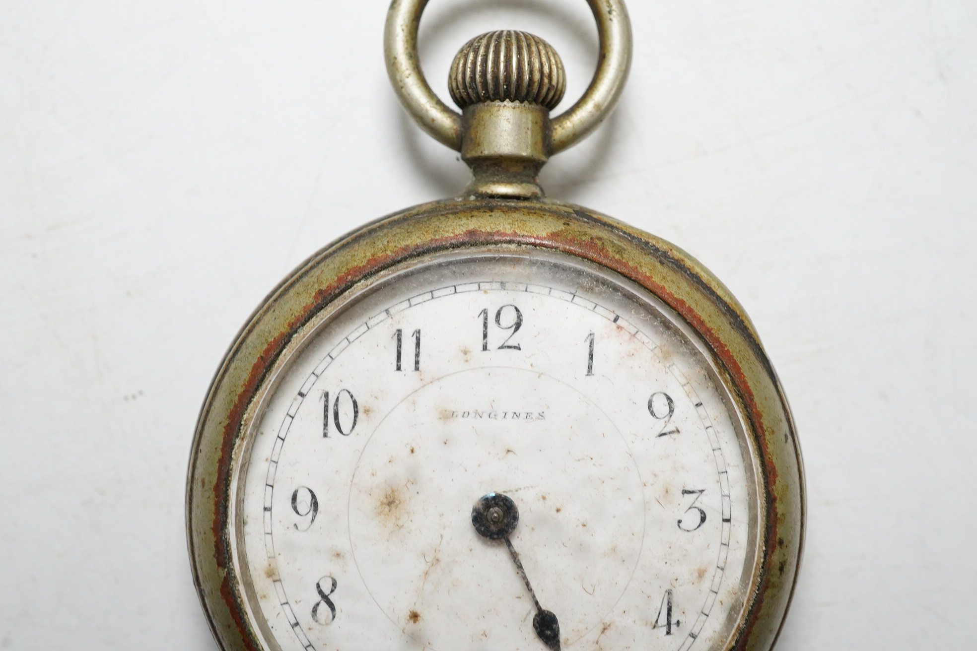 An early 20th century Longines base metal keyless pocket watch. Condition - poor, movement not going